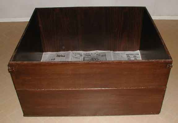 Photo of the Whelping Box lined with newspapers